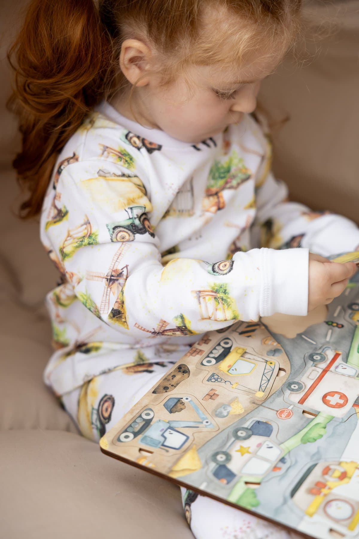 A child wearing LUMIÉREX countryside-print cotton pyjamas